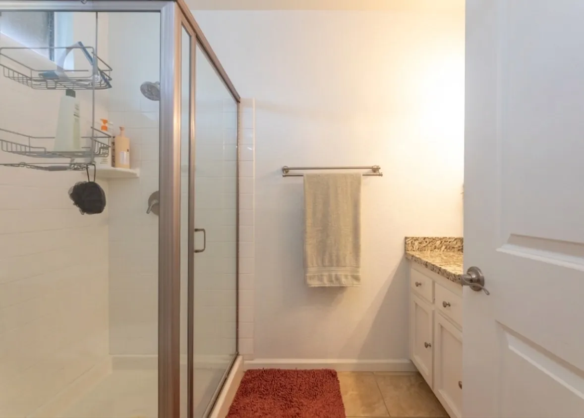 Framed glass step-in shower