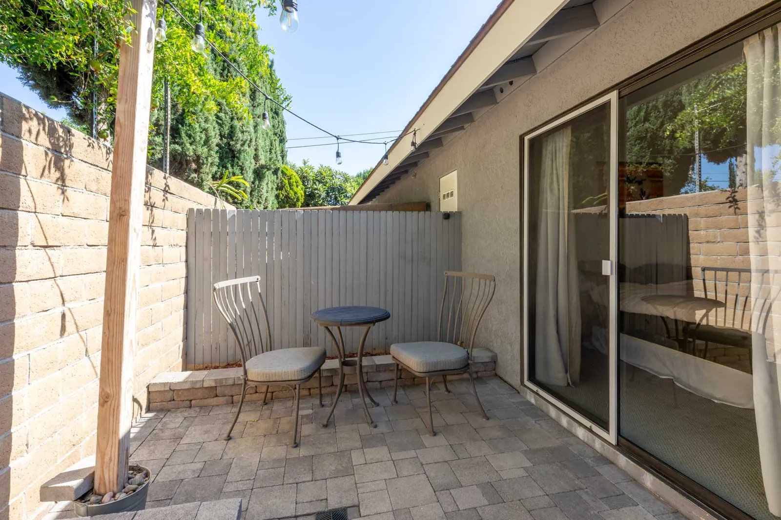 Patio seating beside the sliding doors
