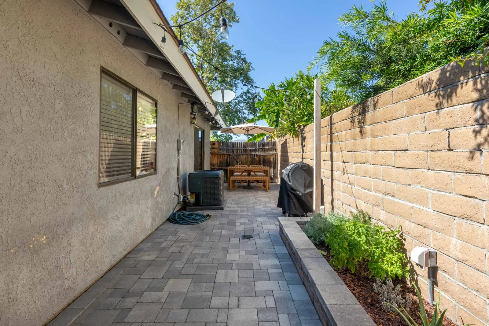 Patio with greenery and privacy wall