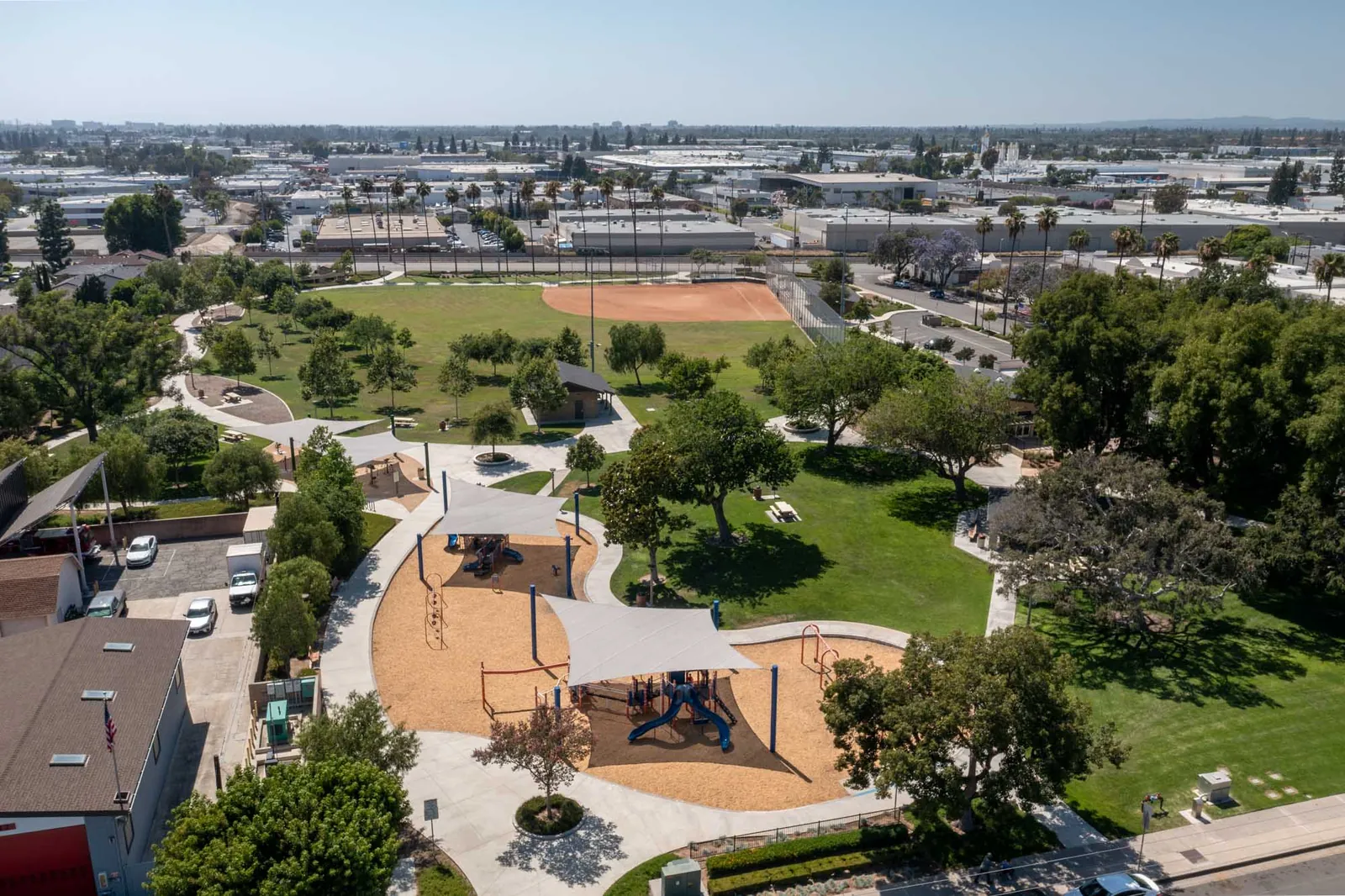 Aerial view of a nearby park playground and walking paths