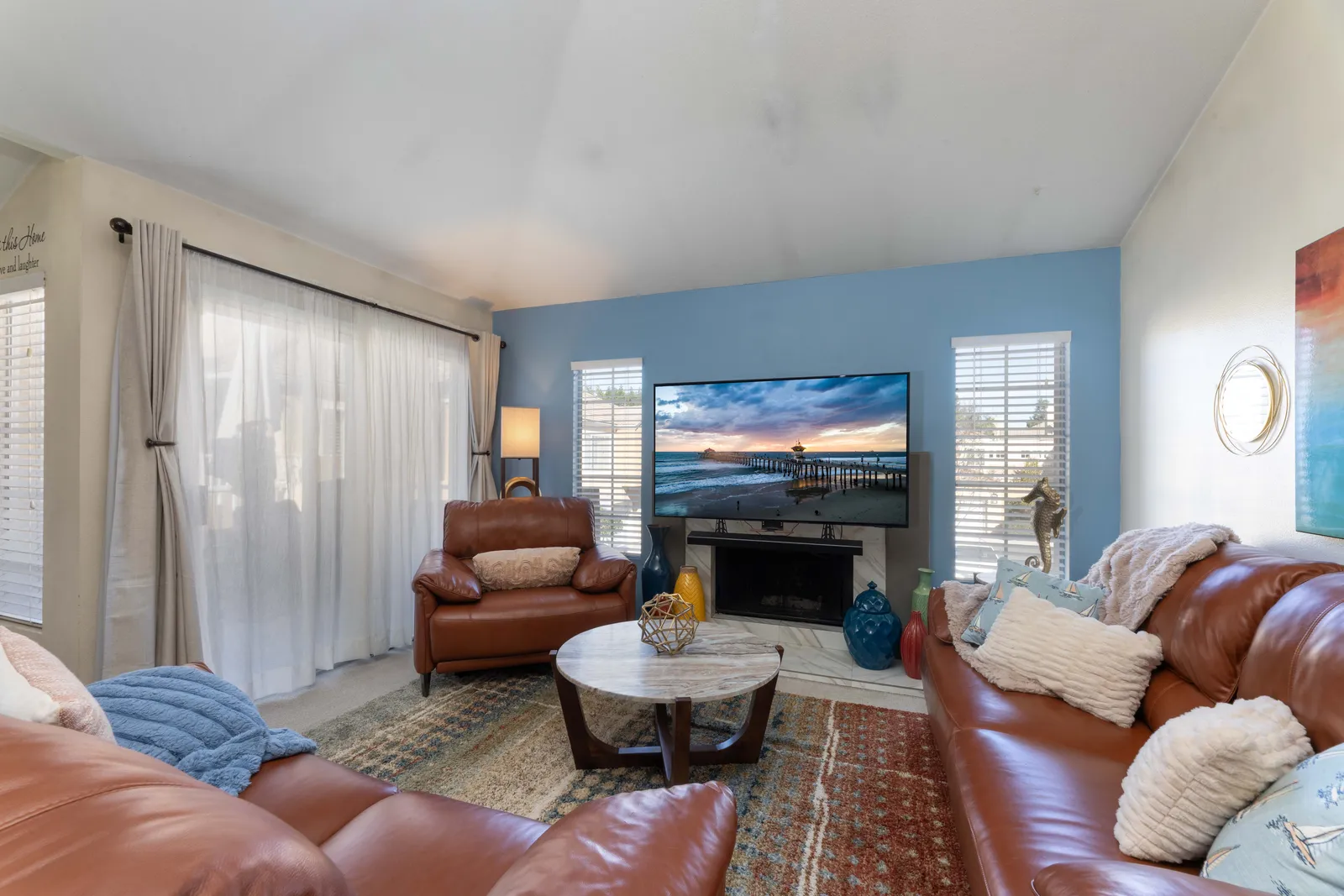 Living room with vaulted ceiling and gas fireplace